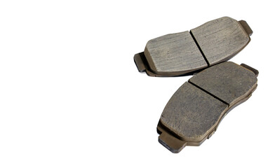 Old car front brake pads on white background