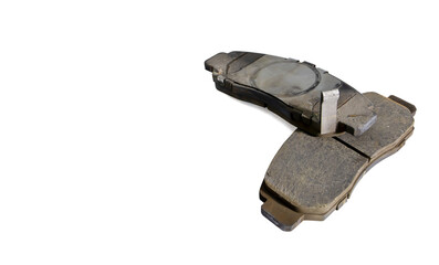 Old car front brake pads on white background