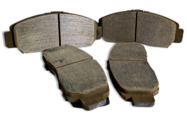 Old car front brake pads on white background