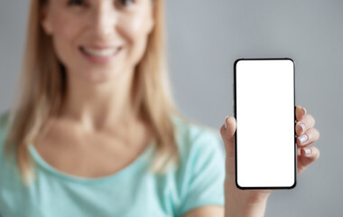 Woman holding phone with blank screen