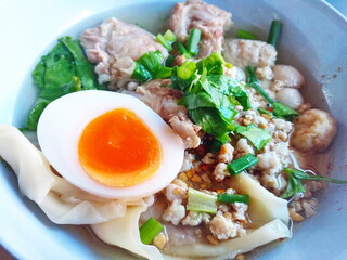 Noodles with pork and egg balls with soup Thai style.