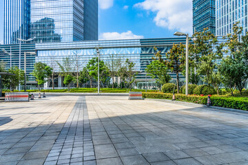 modern glass building exterior with empty pavement