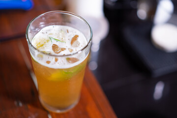 single a cup of yellow mixed drink glass ready to dink