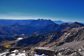 View of mountain landscape from White Baldy and Pfeifferhorn trail, Box Elder and Mill Canyon Peak, American Fork Canyon and Silver Lake in fall, Wasatch Rocky mountain range, Utah, United States. 