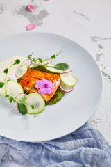 Salmon fillet with zucchini and cream of broccoli
