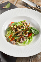 Oyster mushrooms and meat salad plate