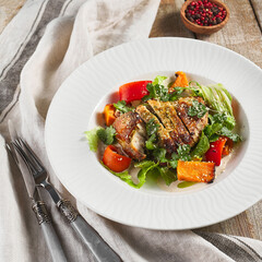Chicken fillet with baked vegetable salad