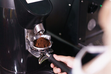 make a coffee with coffee machine in cafe