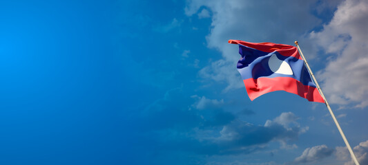 Laos national flag with blank text space on wide background.