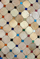 Pattern of colored tiles with rhombuses. Colored tiles on the floor at the entrance to the...