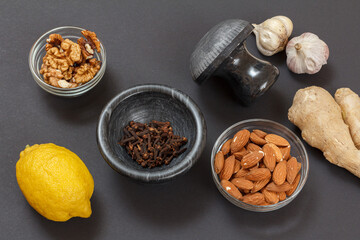 Health remedy foods for cold and flu relief on a black background.