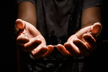 Male hands with open palms.
