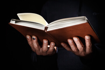 Open book in man hands.