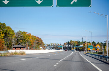 Toll split highway with payment terminal and road signs