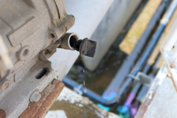 Oil spills on the floor and water