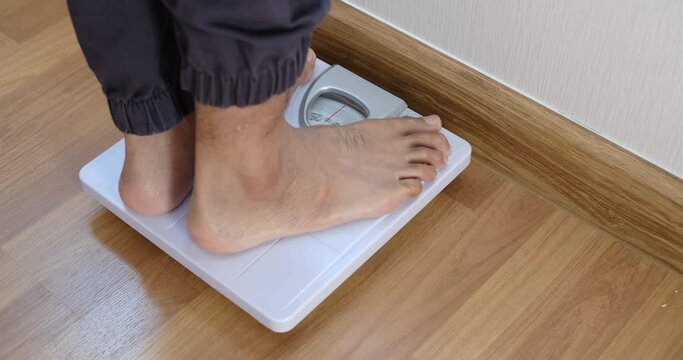 Close up body weight scales for measure weight loss.Weighing scale to healthy slimming concept.