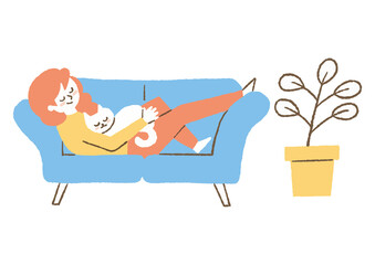 猫とソファーに寝る女性