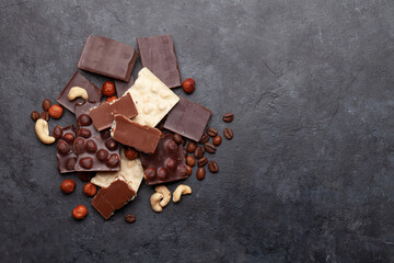 Various chocolate pieces, coffee beans and nuts