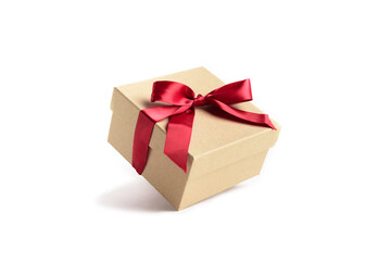 Craft gift box with red ribbon bow isolated on white background.