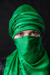 Fototapeta premium Beautifu musliml woman dressed in green headscarf