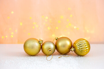 christmas background with bokeh lights and golden christmas balls