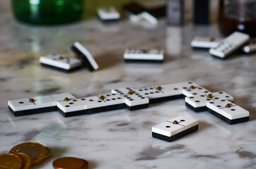Selective focus shot of playing dominos on a marble table