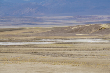 Wide open expanses and terrain at Death Valley National Park on a stormy and cloudy day