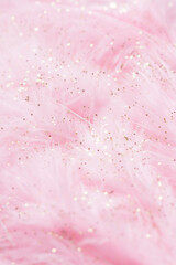 Fototapeta premium Pink fluffy feathers with gold glitter