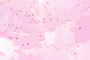 Pink Easter bunny confetti on a coral pink background