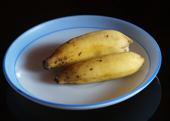Two Banana's in a plate
