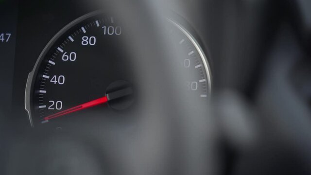 Car tachometer and moving pointer, car dashboard panel detail closeup. High quality 4k footage