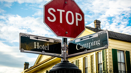 Street Sign to Camping versus Hotel