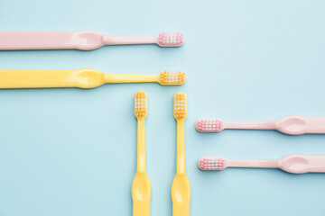 Toothbrushes on color background