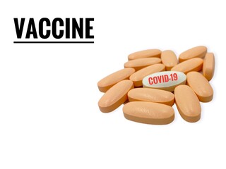 VACCINE text and pills on white  background. Covid-19 or Coronavirus Concept