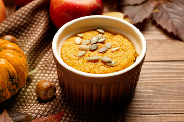 Tasty pumpkin pudding on table