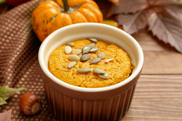 Tasty pumpkin pudding on table