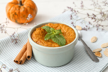 Tasty pumpkin pudding on table