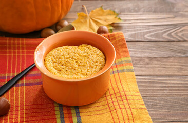 Tasty pumpkin pudding on table