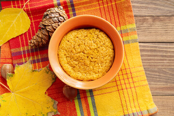 Tasty pumpkin pudding on table