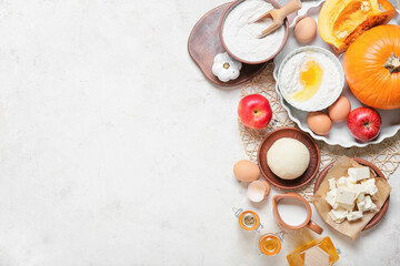 Ingredients for preparing pumpkin pie on light background