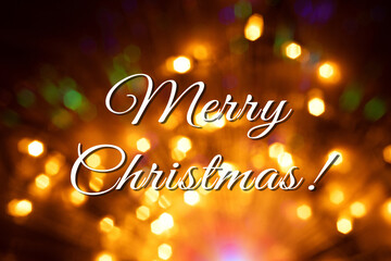 Merry christmas text on abstract golden lights bokeh background