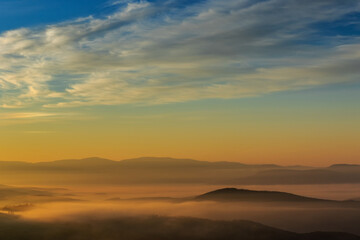 Fototapeta na wymiar Beautiful foggy sunrise in the mountains