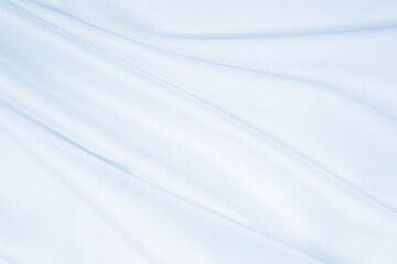 Smooth elegant blue silk or satin luxury cloth texture as abstract background. Luxurious background design