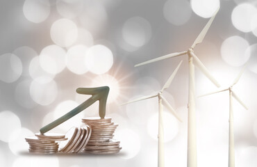 Renewable clean energy investment for sustainability concept and alternative energy economic growth idea. Arrow upwards on stack of coins on bokeh background