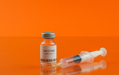 Coronavirus vaccine vial and medical syringe