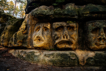 Monument sandstone rock sculptures and Harfenice (Harfenist) cave created by Vaclav Levy between Libechov and Zelizy, Cliff carvings carved in pine forest, Czech republic
