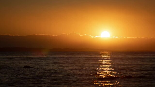 Time lapse video of rising sun trough the clods over Oslofjord in Southern Norway