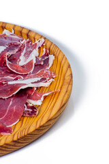 Portions of ham on wooden tray on white background