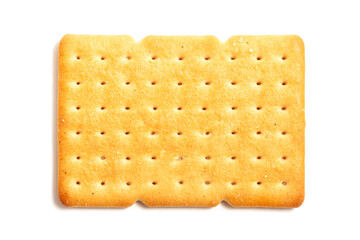 Saltine or soda cracker lightly sprinkled with coarse salt on a white background. One square biscuit on the table. Morning breakfast snack. Wheat light meal snack in lunch time. Salty cookies.