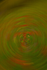 abstract circular movement of red and green Christmas colour themed camera motion blur slow shutter speed effect
